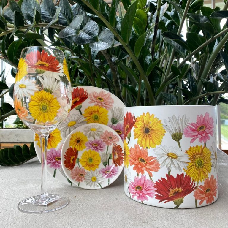Floral dining set with a wine glass, large and small plate, and planter