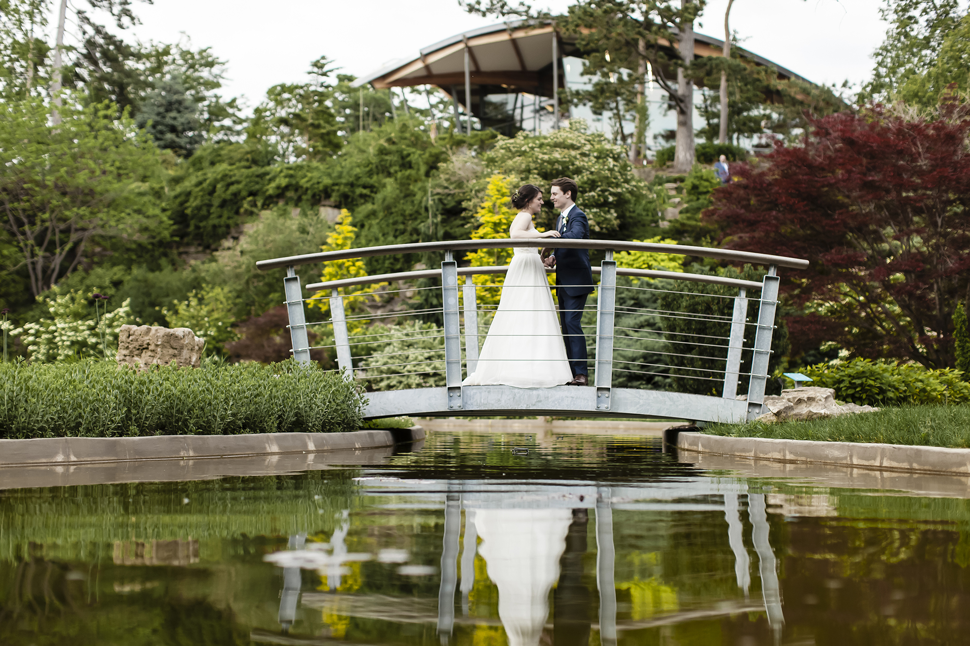 Wedding-bride-and-groom-on-bridge-rock-garden-credit-Fotoflare Bride and Groom posing on Bridge at Rock Garden