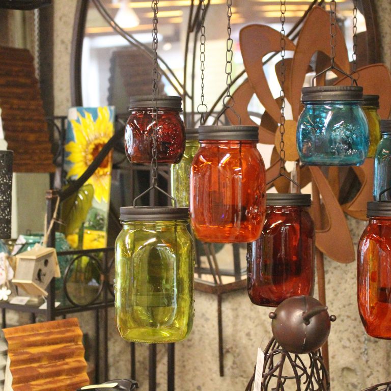 Shop Fall Display including coloured mason jars hanging from chains