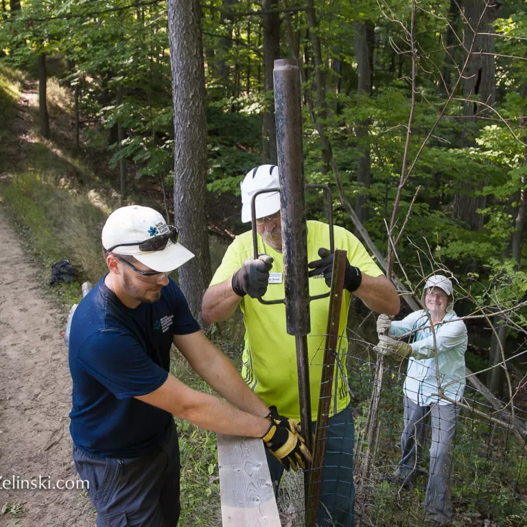 Volunteers and staff Installing Fence Posts on an RBG trail