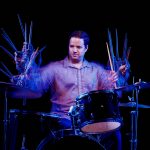 ernesto sitting at a drum kit