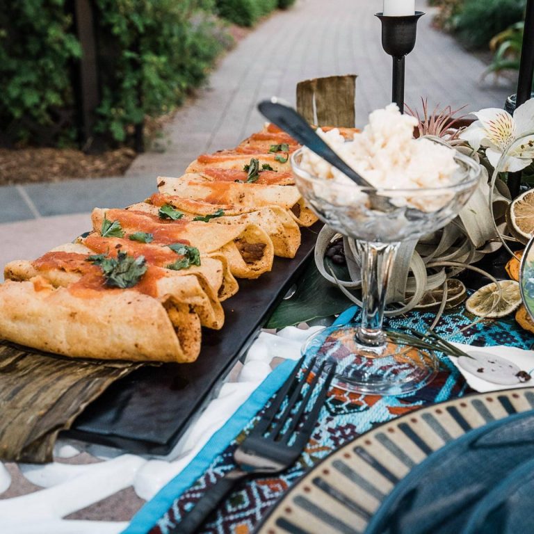 Catered spread of Guatemalan cuisine on an outdoor table