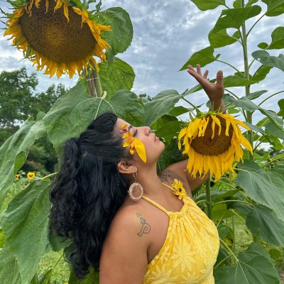 Irma Villafuerte Irma Villafuerte posing with sunflowers