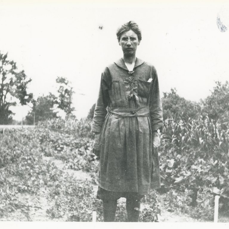 Isabella Preston standing in garden - archival photo