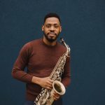 jesse ryan holding a saxophone