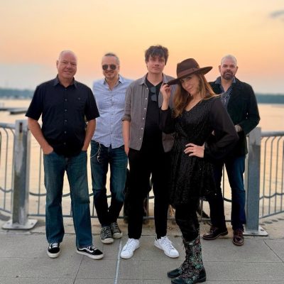 Loralee TAXI band: 5 band members posing on the waterfront