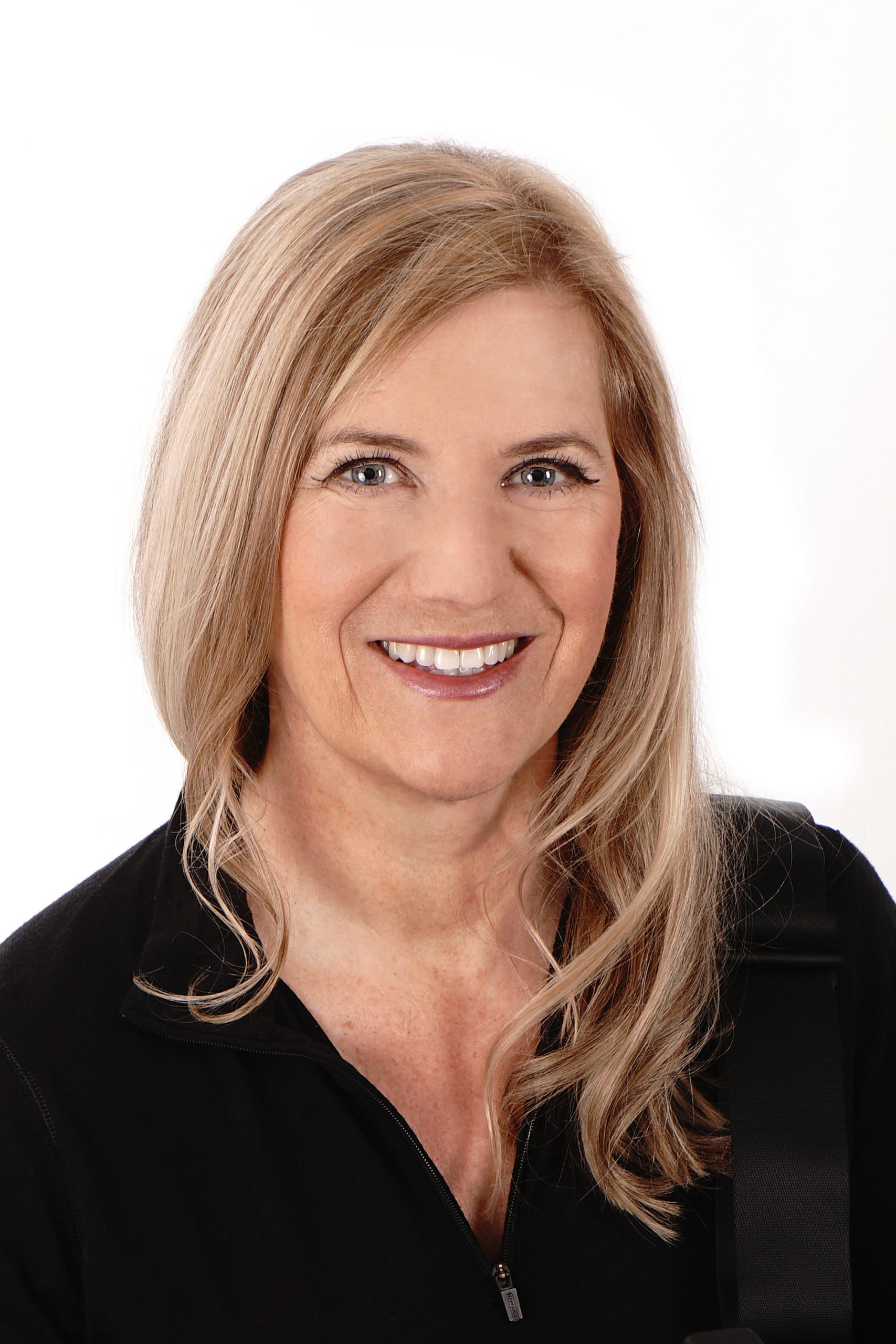 Portrait of Maris Butcher smiling.