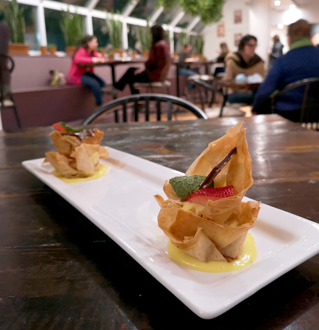 Shade grown espresso strudel cups with chili chocolate bark, plated beautifully at the greenhouse cafe