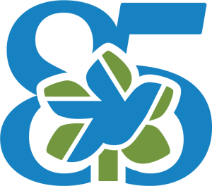 “85” anniversary logo featuring a blue number integrated with a bird silhouette and green leaf motif