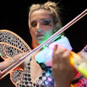 Emily Misura Musician emily misura playing a fiddle, dressed as a magical fairy