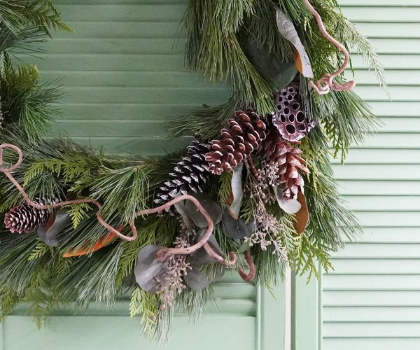 WreathWorkshop_closeup Handmade evergreen wreath featuring pinecones and other natural materials