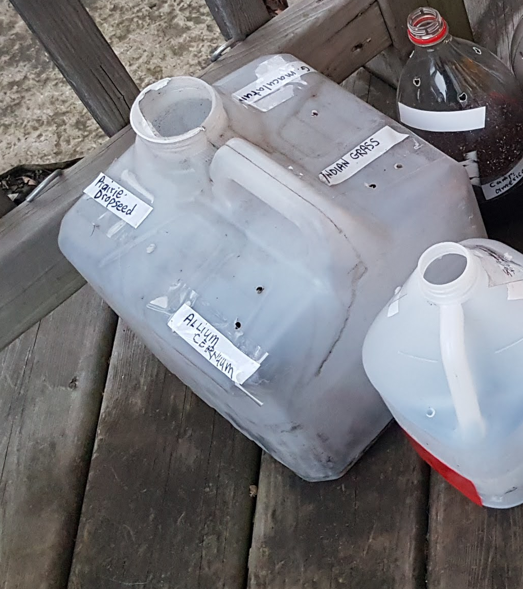 big-top-w-4-pots-outside plastic jugs full of soil