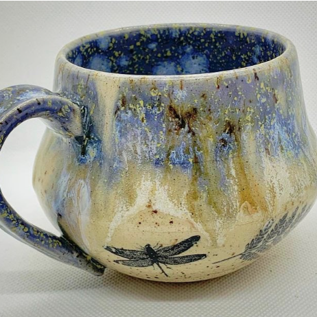 Ceramic mug featuring dragonflies