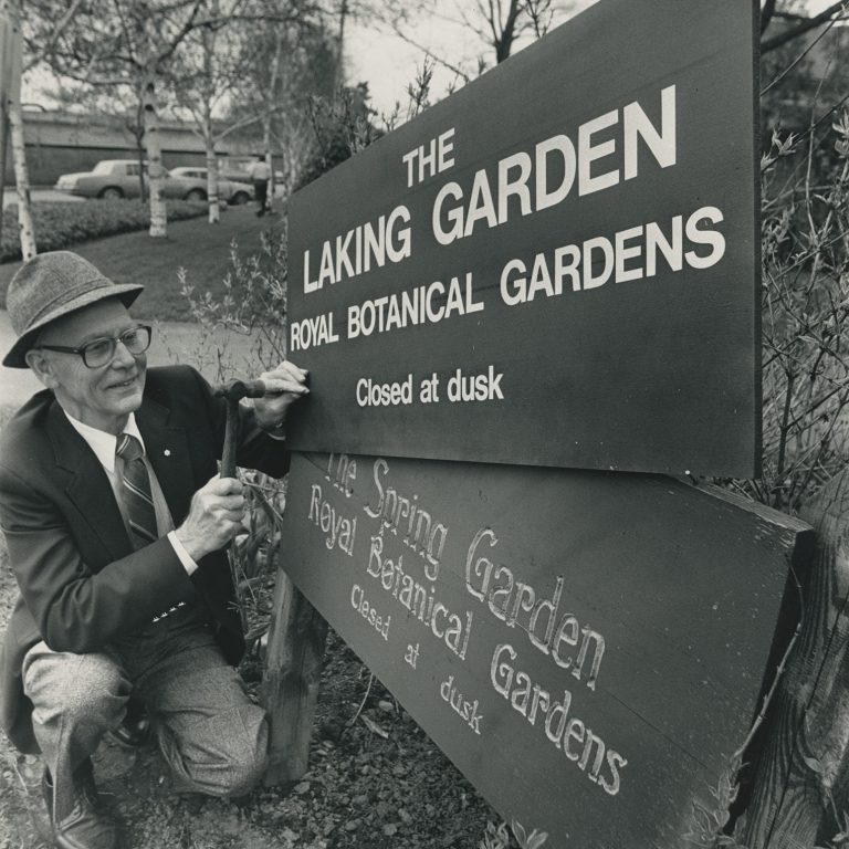 Archival image of changing a sign from Spring Garden to Laking Garden