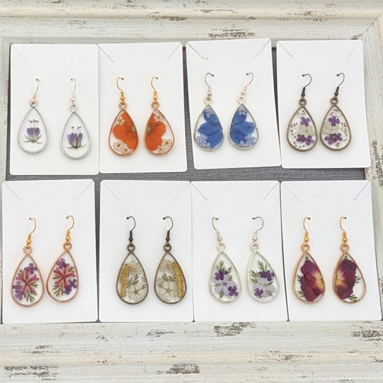 display of earings featuring pressed florals