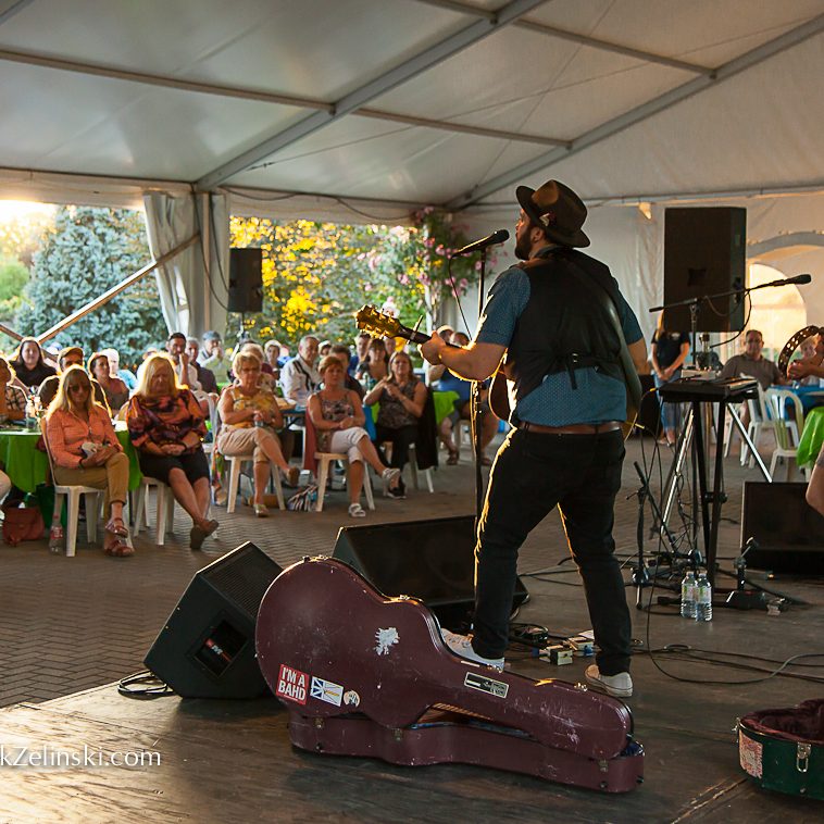 Folk Musicians Performing On Stage Under Tent Credit Markzelinski.com