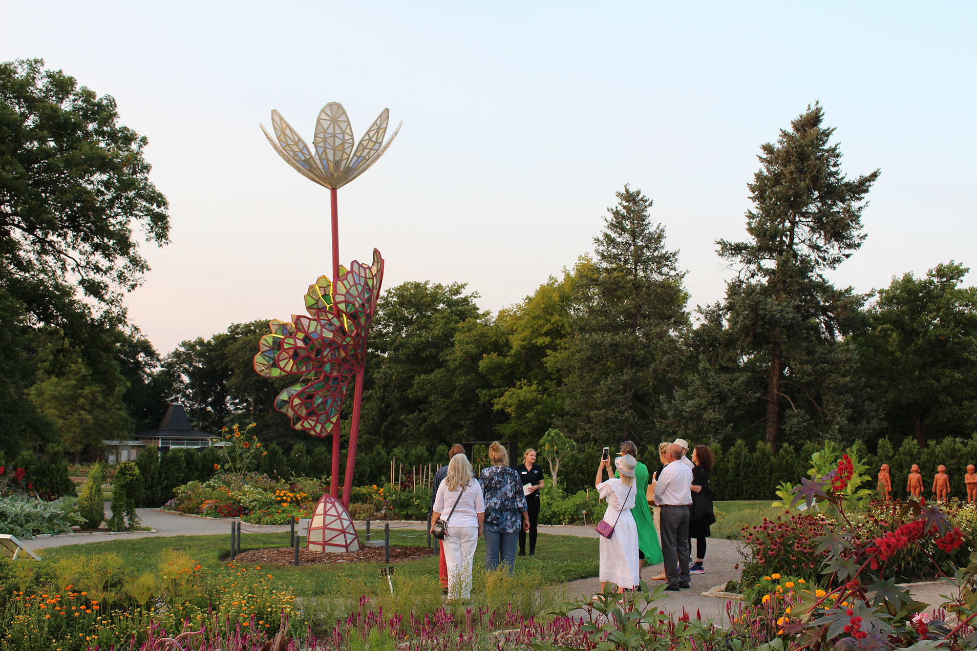 Group taking a tour, lookingat Bloodroot Sculpture