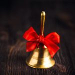 hand-bell golden hand bell with festive red bow