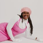aisha barrow laying on her side and smiling