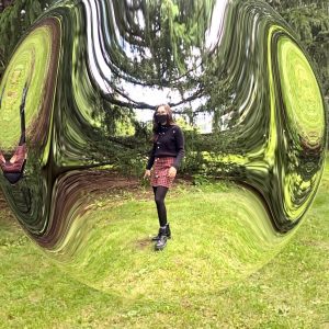 seeing the invisible - Pneuma, Mel O'Callaghan Emily standing in the centre of a bubble in the garden
