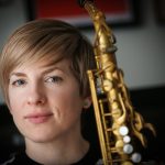 tara davidson holding her saxophone