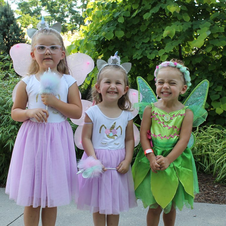 Three children dressed as fairies