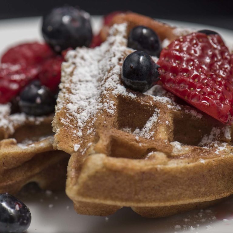 Waffles With Icing Sugar And Berries